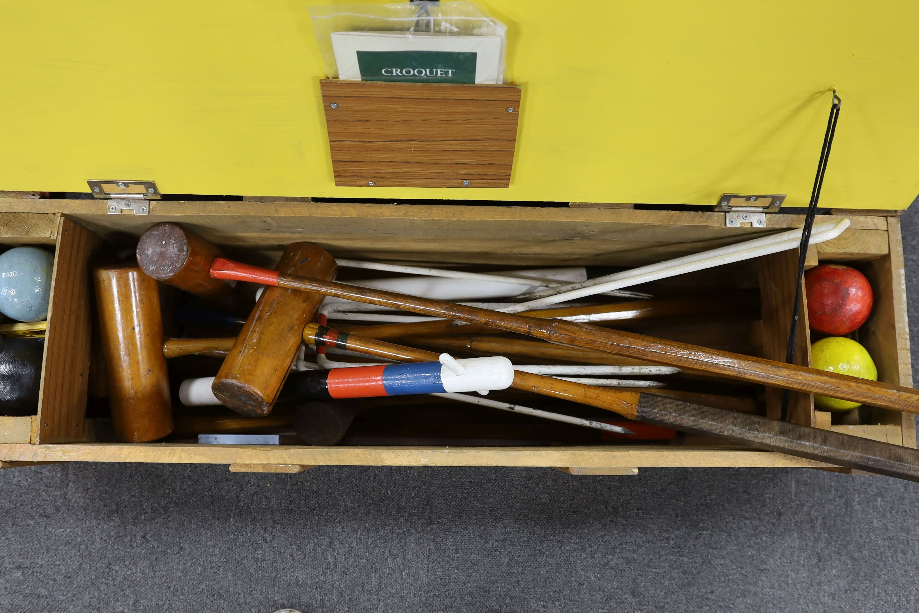 A vintage matched croquet set in later case